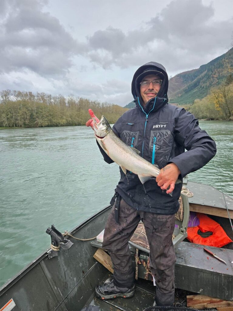 Shane Daniels holding up a fish caught on the nooksack river